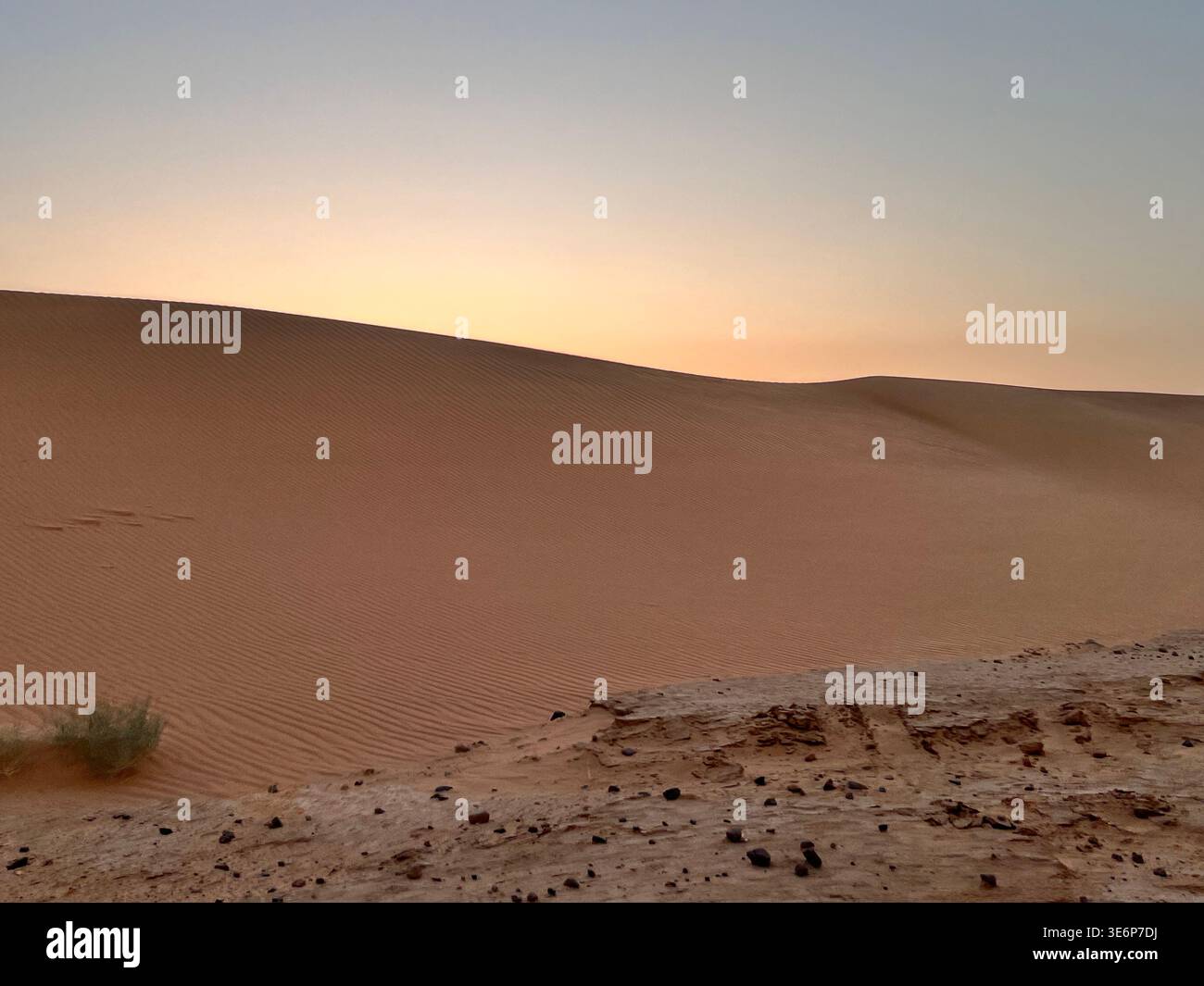 Minimal desert dune under soft evening light in Wadi Rum Protected Area, Jordan - Smartphone Captured Stock Image