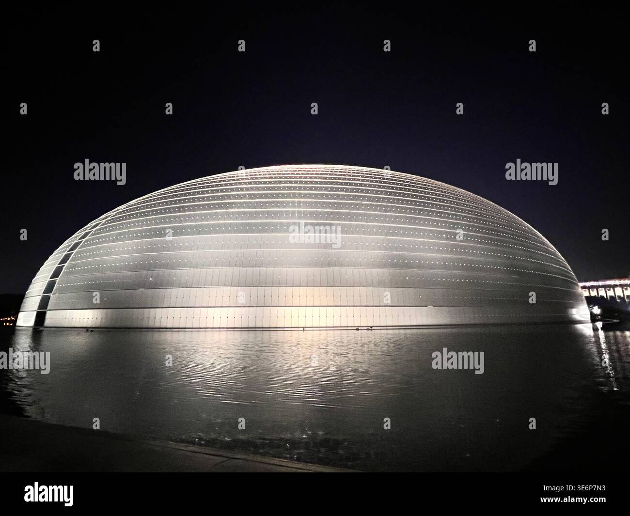 National Centre for the Performing Arts reflected in water at night in Beijing, China. - Smartphone Captured Stock Image