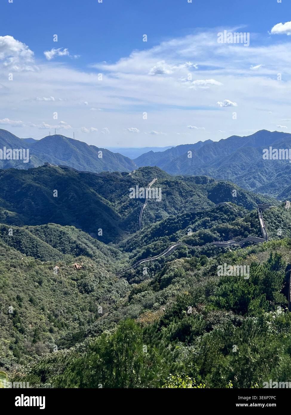 Wide panoramic view of the Great Wall across mountain valleys near Beijing, China. - Smartphone Captured Stock Image
