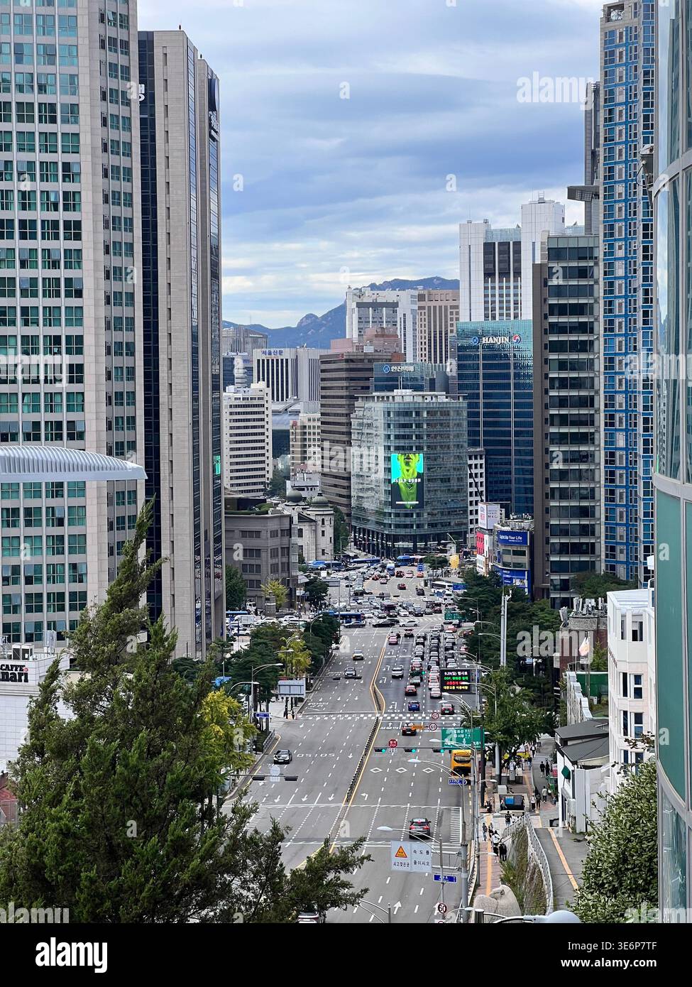 Downtown street canyon between office towers in Seoul, South Korea. - Smartphone Captured Stock Image