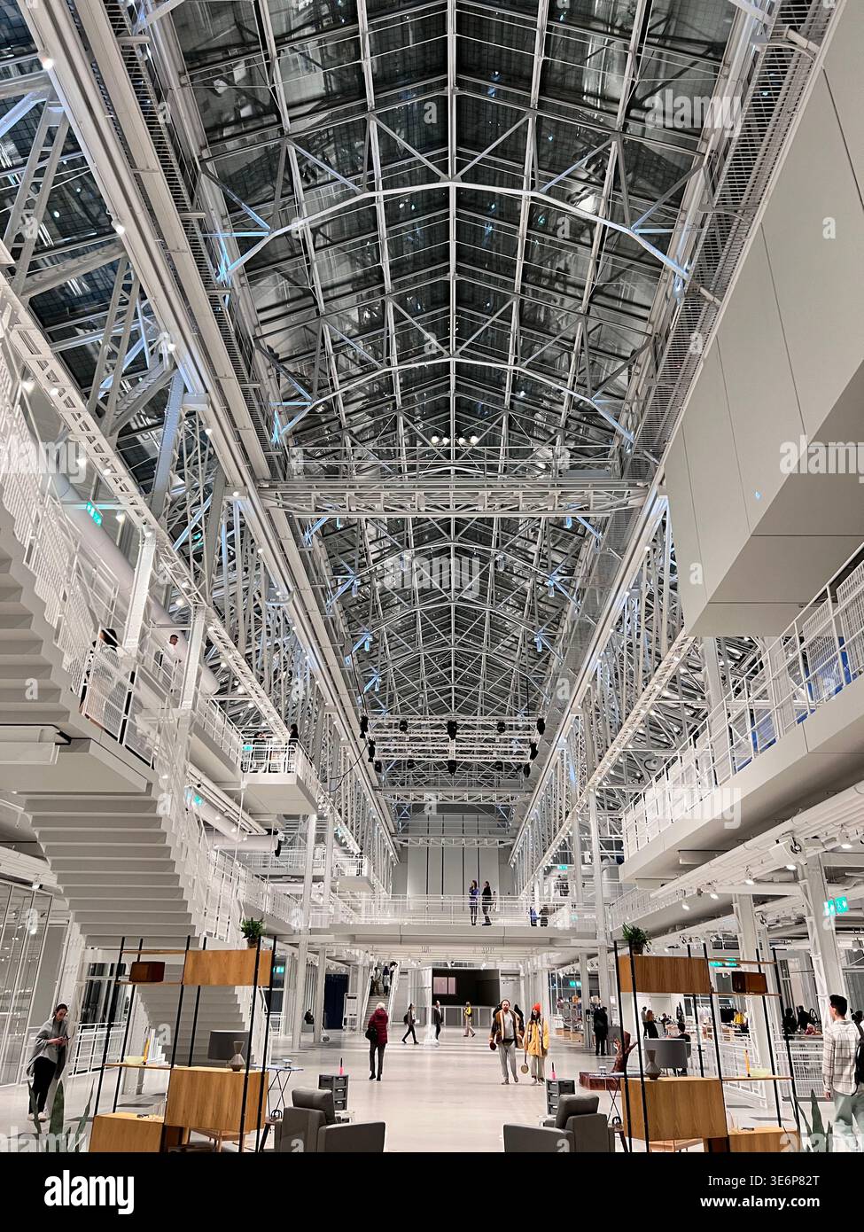 Symmetrical interior of GES-2 House of Culture with steel roof structure in Moscow, Russia - Smartphone Captured Stock Image