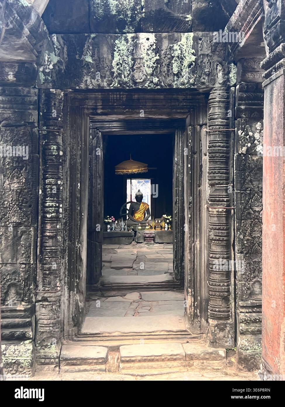 Stone doorways aligned through the interior of Banteay Kdei in Siem Reap, Cambodia. - Smartphone Captured Stock Image