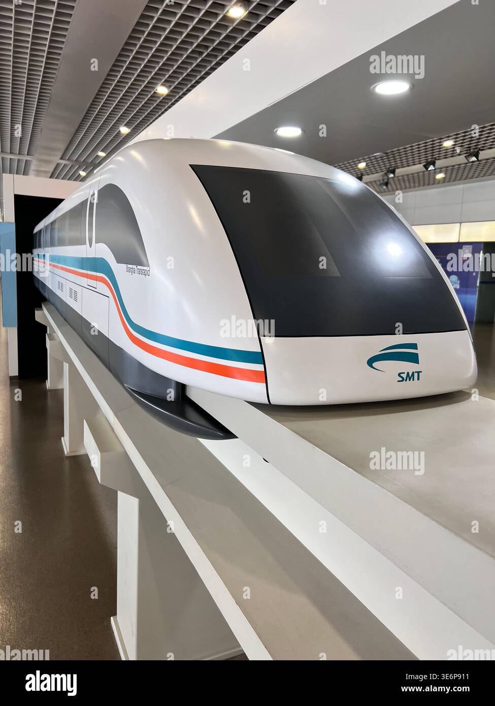 High-speed Maglev Train display inside a modern transport station interior in Shanghai, China. - Smartphone Captured Stock Image