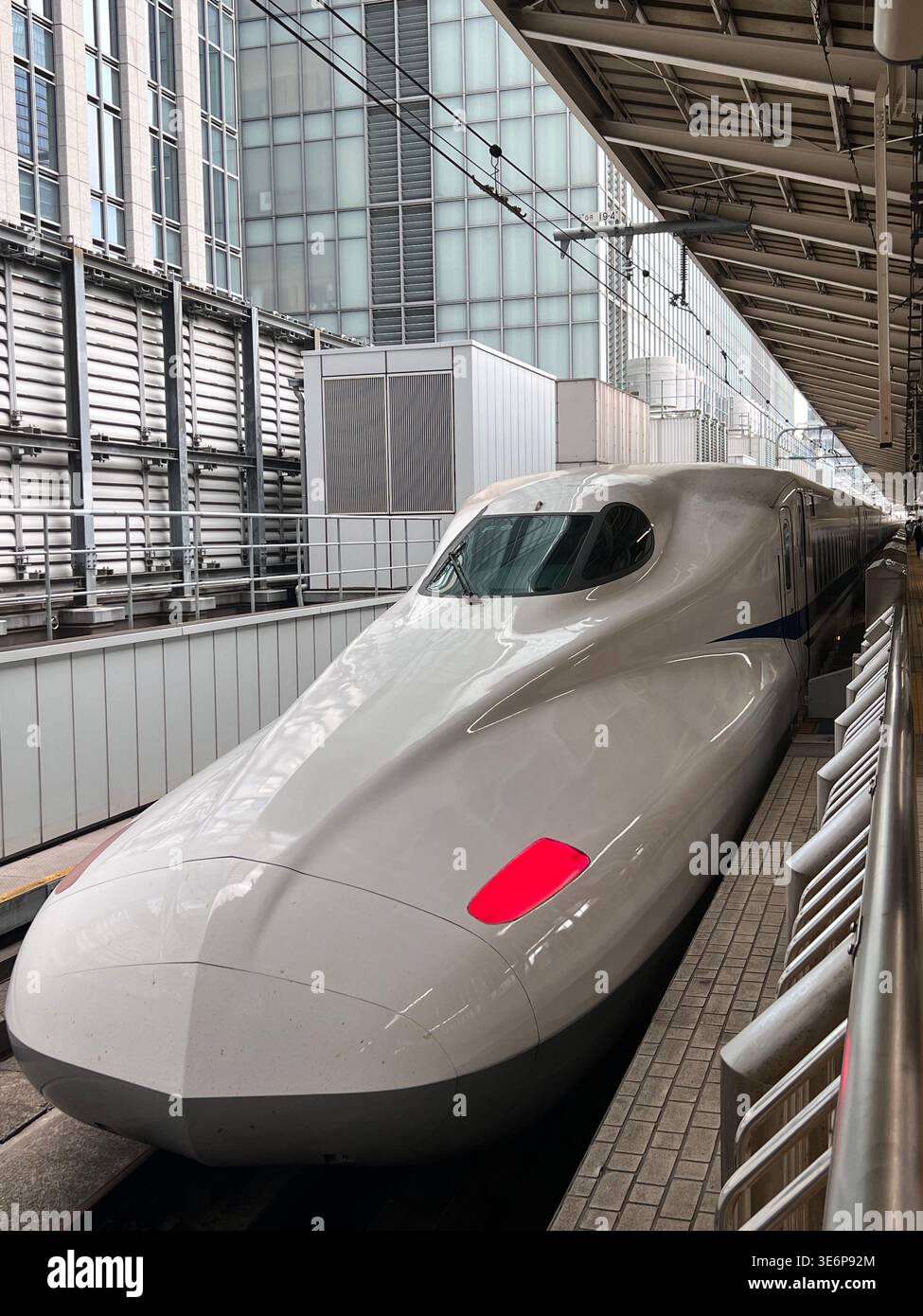 Shinkansen bullet train stopped at a station platform in Tokyo, Japan. - Smartphone Captured Stock Image