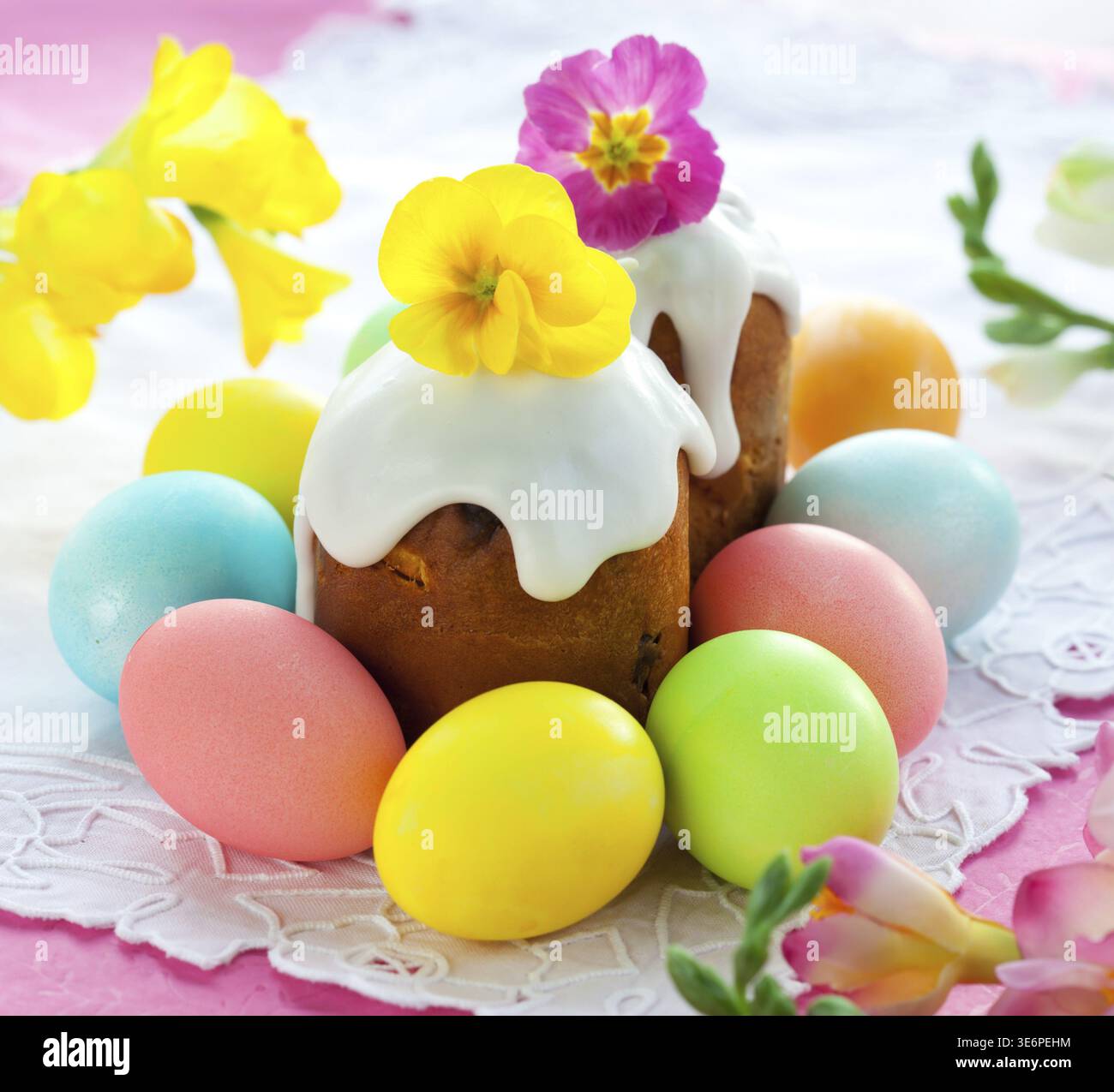 Food, Easter cake with glace icing and coloured easter eggs Stock Photo