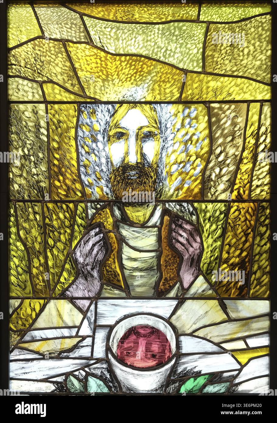 Eucharist, stained glass window by Sieger Koder in church of Saint Bartholomew in Leutershausen, Germany Stock Photo
