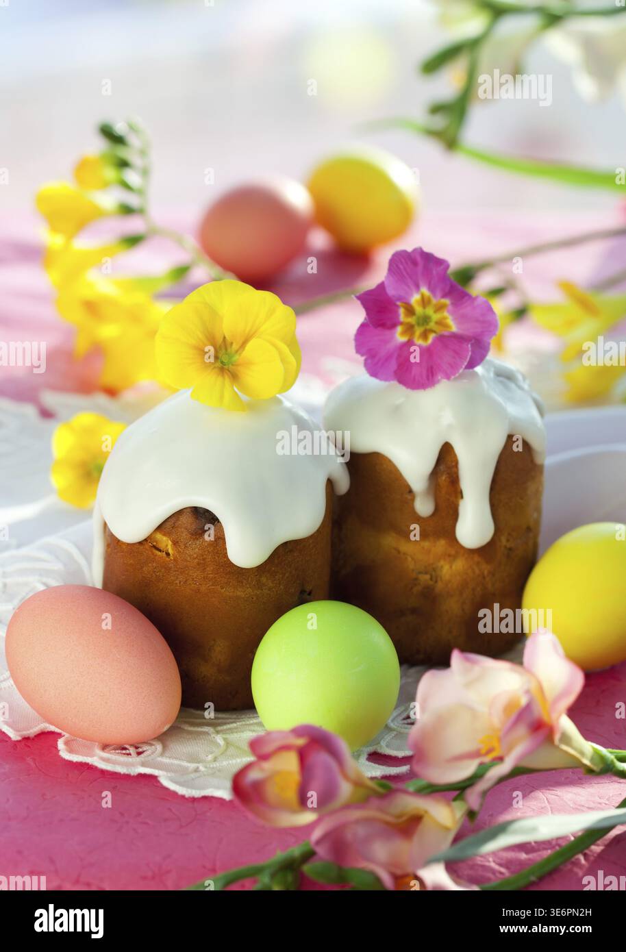 Food, Easter cake with glace icing and coloured easter eggs Stock Photo