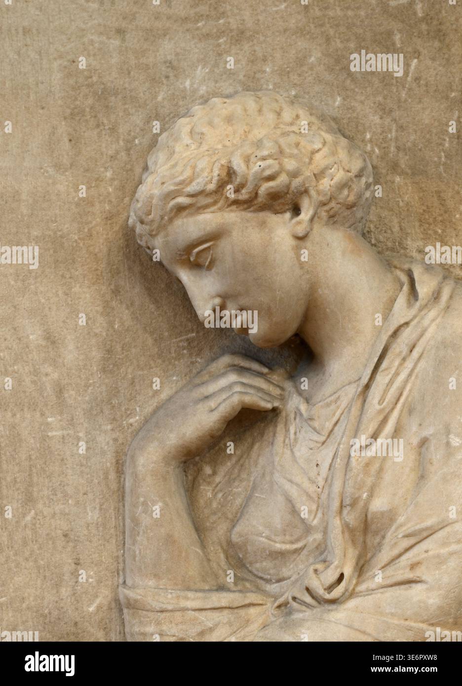 Funerary stele. Woman sitting on a stool, her head lowered in an expression of sorrow. Found in Piraeus and carved from Pentelic marble. First quarter of the 4th century BC. Stock Photo