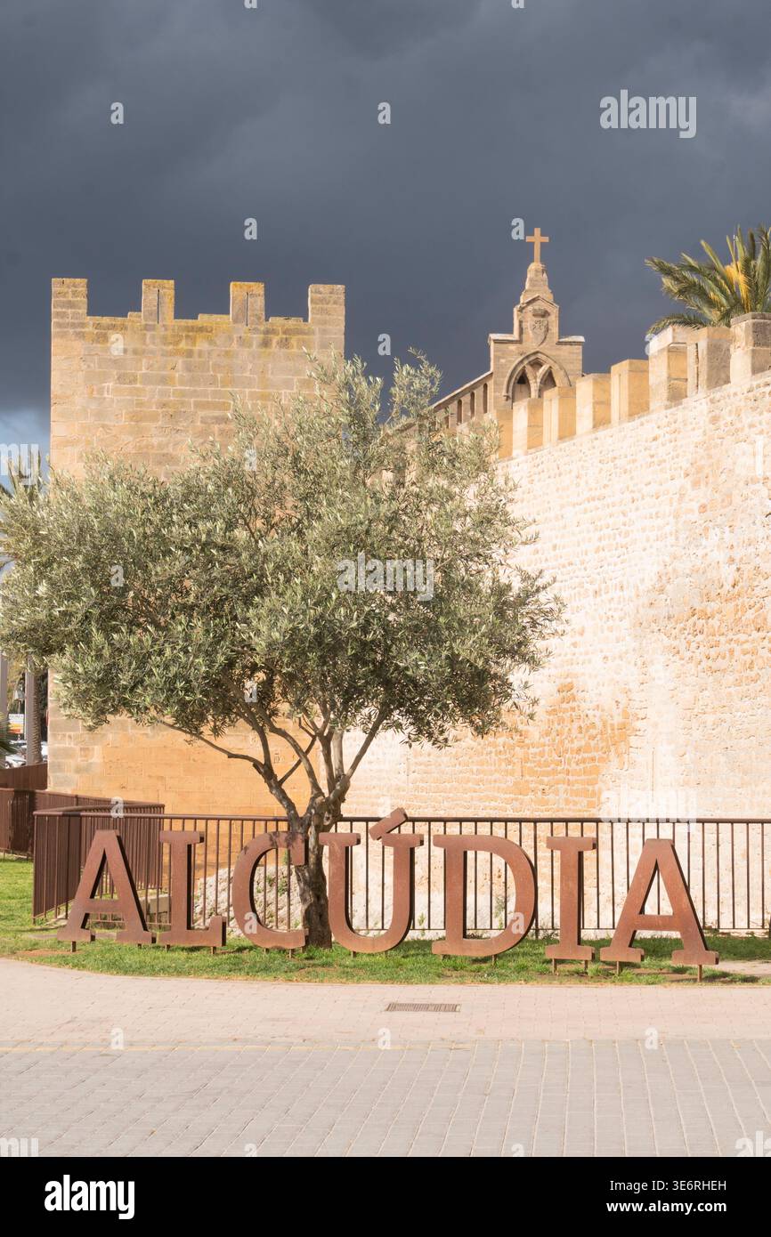 Dark skies above the historic city walls of Alcudia, Mallorca Stock Photo