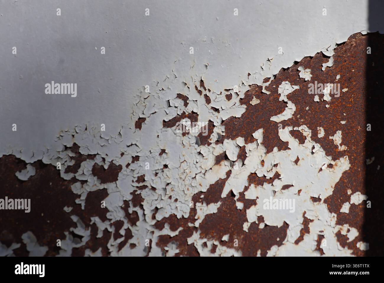 close up of painted metal surface. peeling paint Stock Photo