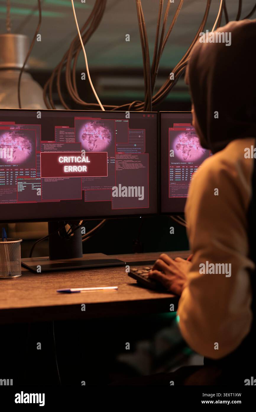 Cyberattack warning on computer screen, hacker stealing data, breaking into database. Malware attack, web virus, ransomware, man writing malicious software code, programming spyware Stock Photo