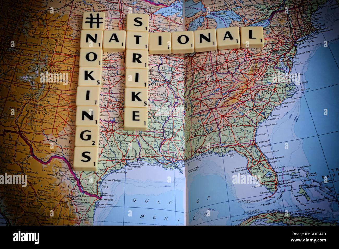 #NoKings No Kings and National Strike slogan spelled with Scrabble letters on a map of the United States of America. Stock Photo