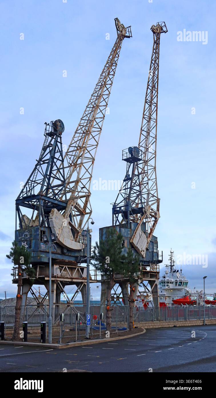 Historic dock cranes at the Port of Leith, Edinburgh, Scotland, reflecting the harbour's industrial heritage. Stock Photo