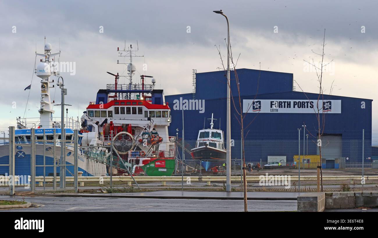 Working vessels and Forth Ports buildings at the Port of Leith in Edinburgh, Scotland. Stock Photo