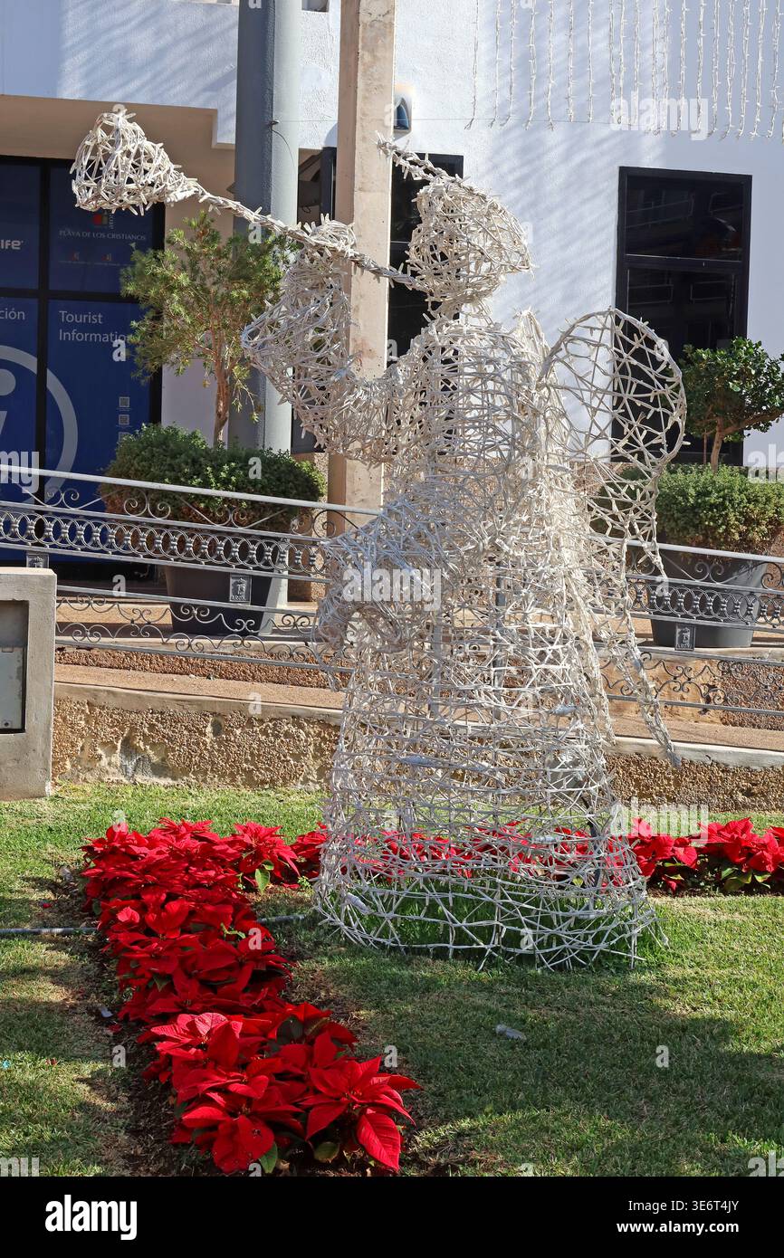 Christmas reindeer light decoration and poinsettias photographed in Tenerife, Canary Islands, Spain. Stock Photo