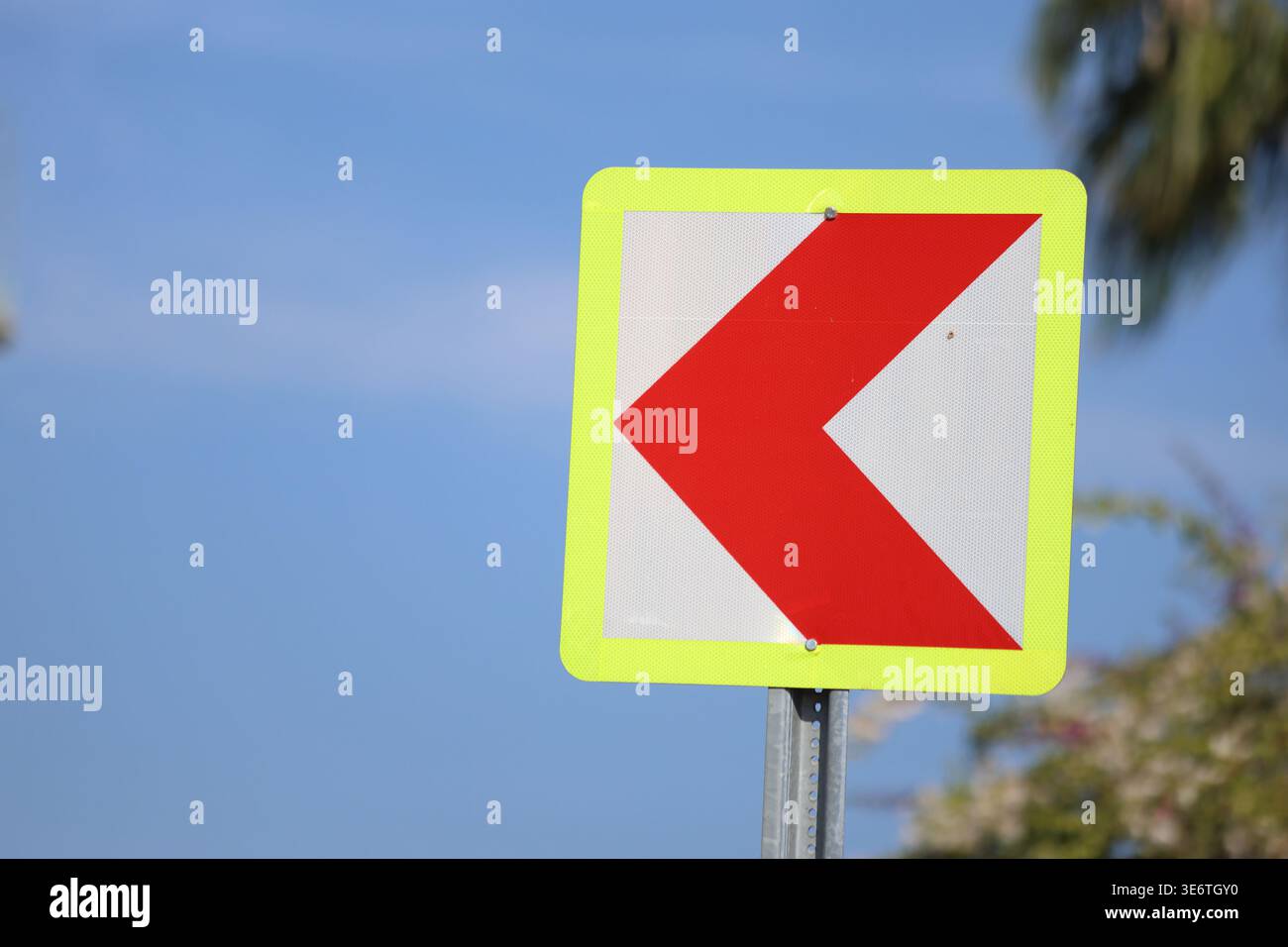 red chevron signs indicating dangerous curve Stock Photo - Alamy