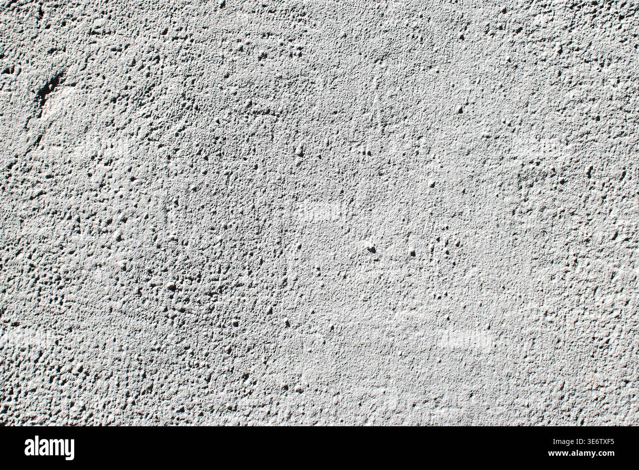 Light gray plaster wall texture with subtle rough surface and natural uneven pattern background Stock Photo