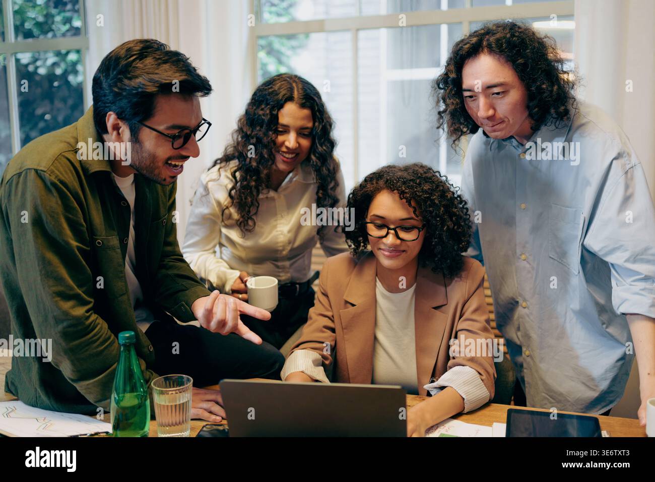 Collaborative Prototype Review Session, Group Engaged In Dynamic Feedback During Project Examination Stock Photo