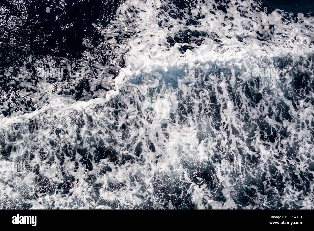 Sea wave foam texture, dark blue water background Stock Photo