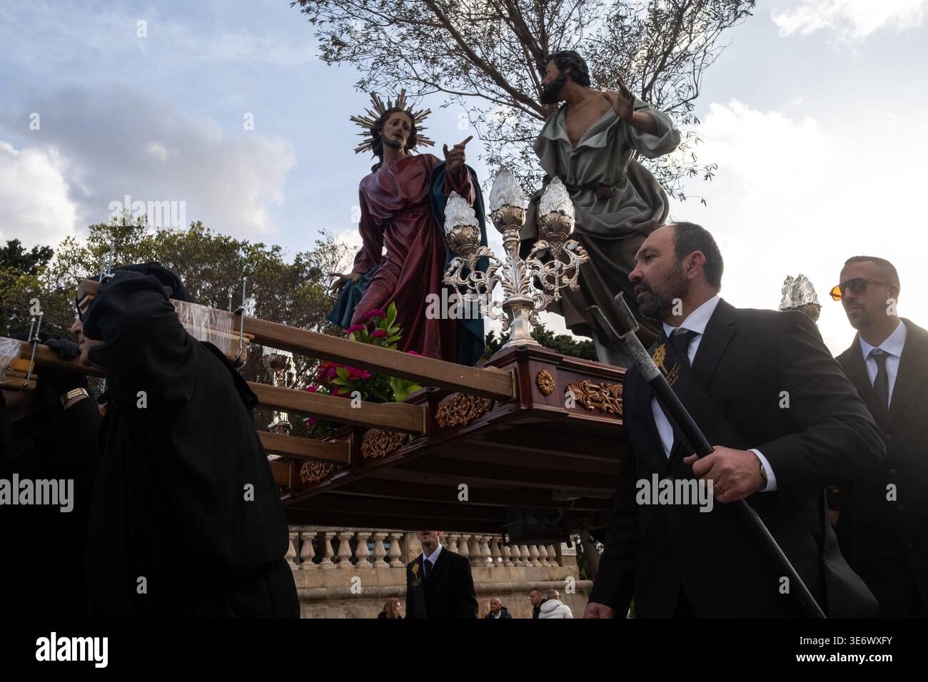 Procession Bearers Bearers carry a Good Friday procession statue showing Jesus Christ with ...