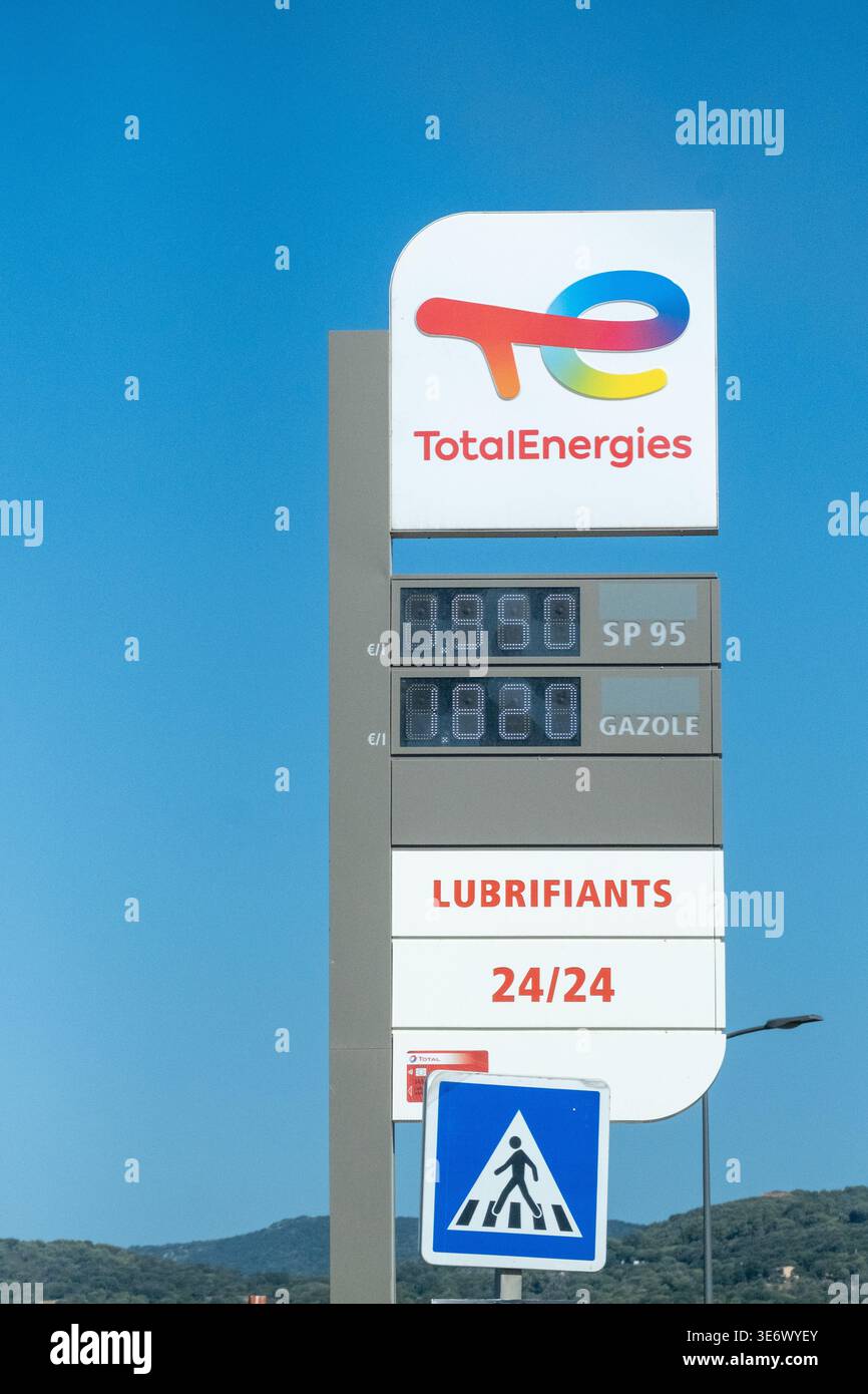 Sp95 Gas A roadside Total Energies fuel price sign shows SP95 and gasole rates ...