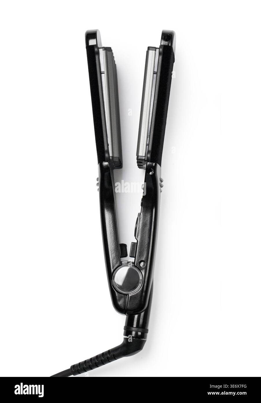 Black hair crimper providing styling for wavy hair Stock Photo