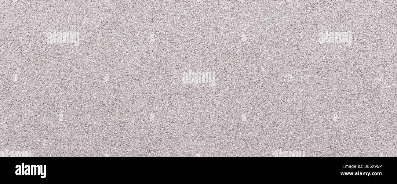 Rough gray wall surface creating an uneven texture background Stock Photo