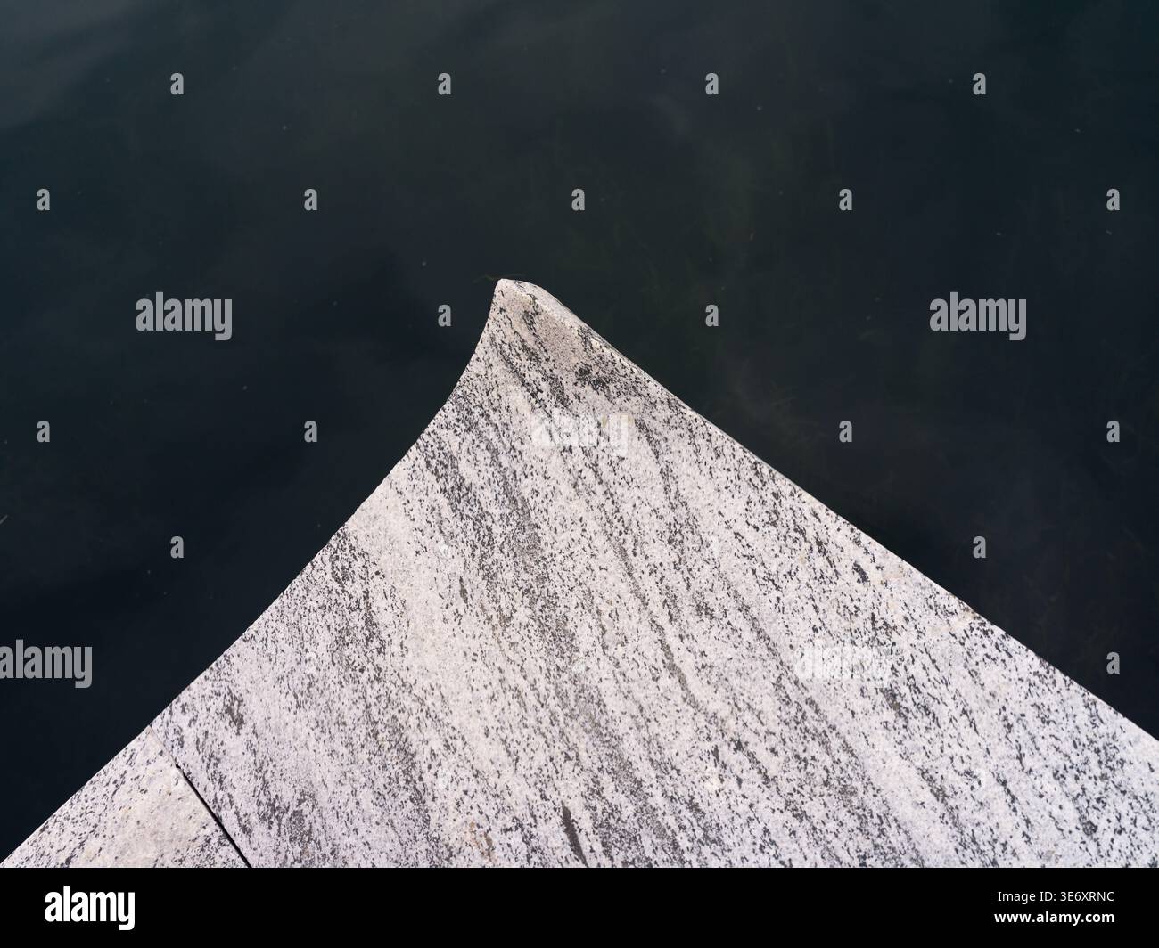 Minimalist abstract view from above showing a sharp, triangular point ...