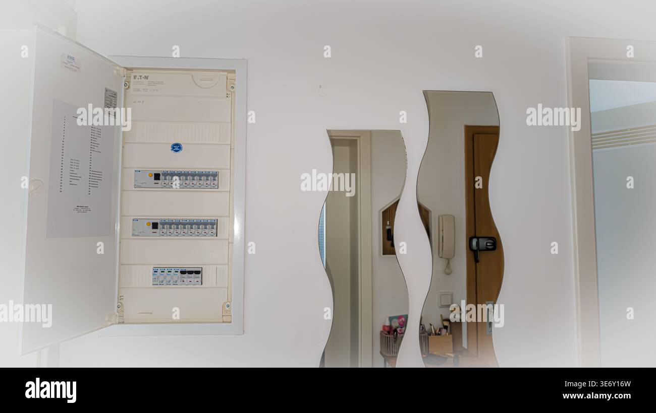 Electrical panel with circuit breakers in home, household electricity distribution box Stock Photo