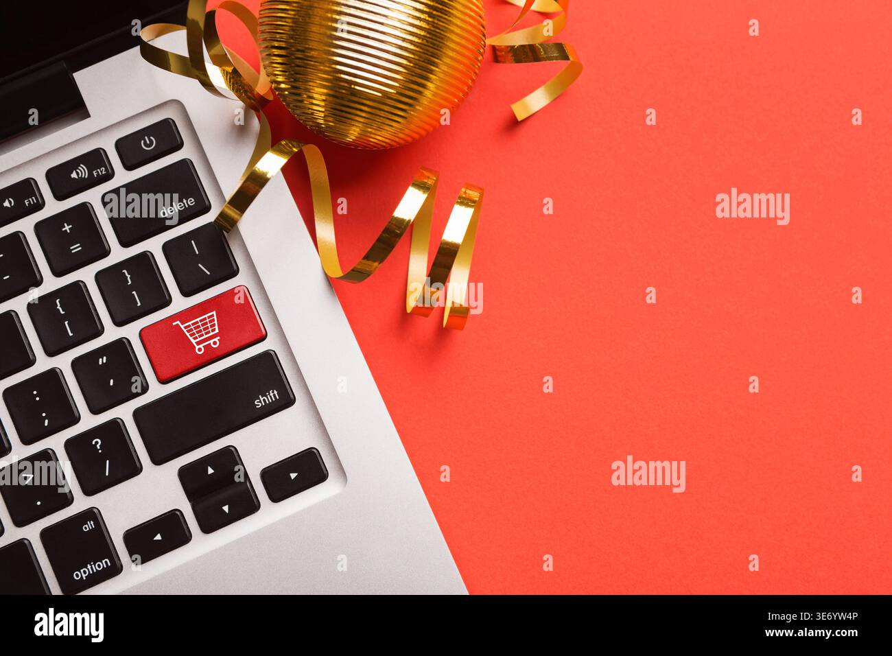 Computer notebook keyboard with icon shopping cart Stock Photo