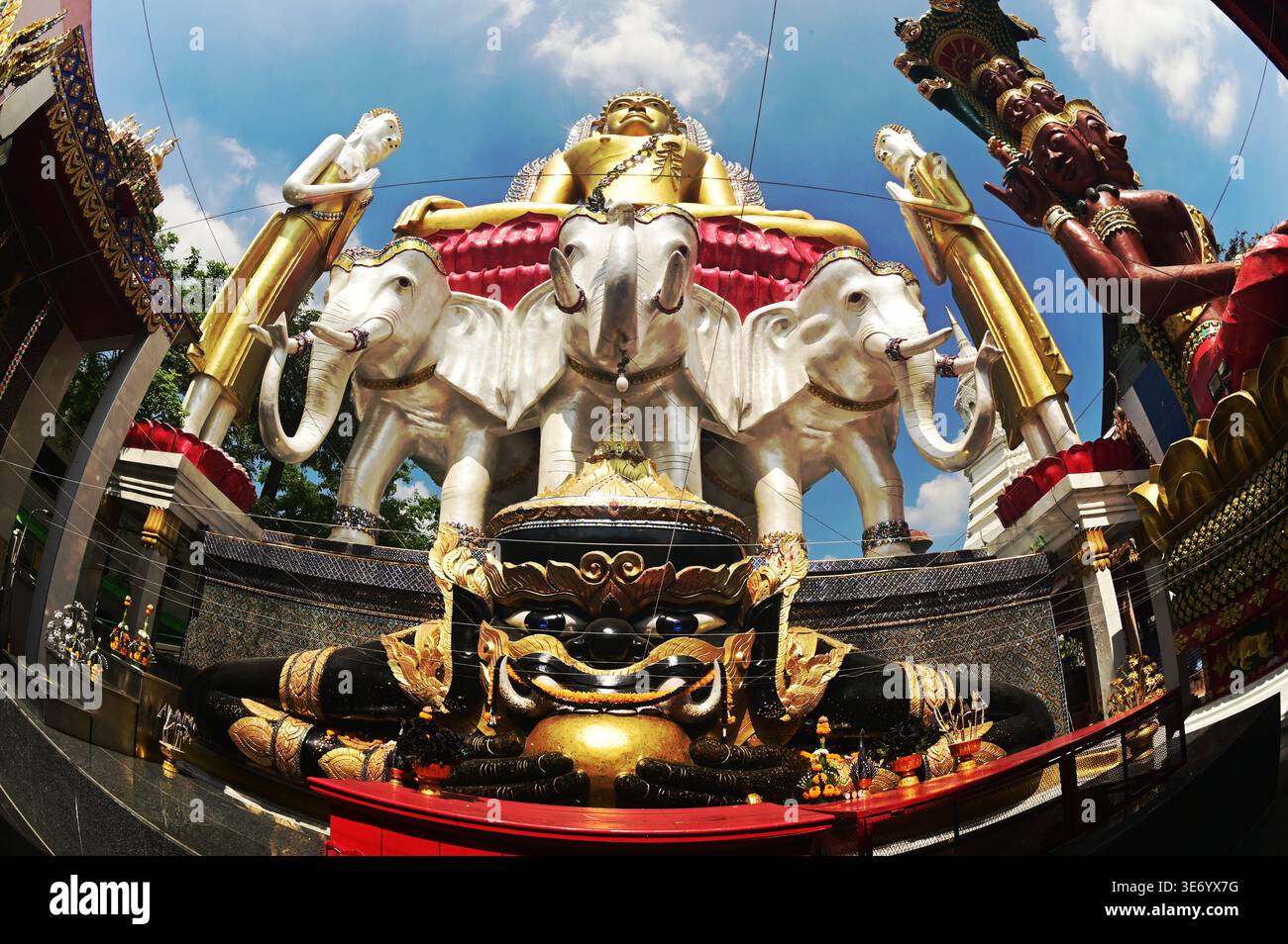 G Rasool Rahu Rahu statue front of golden Buddha and tree headed elephant statue ...