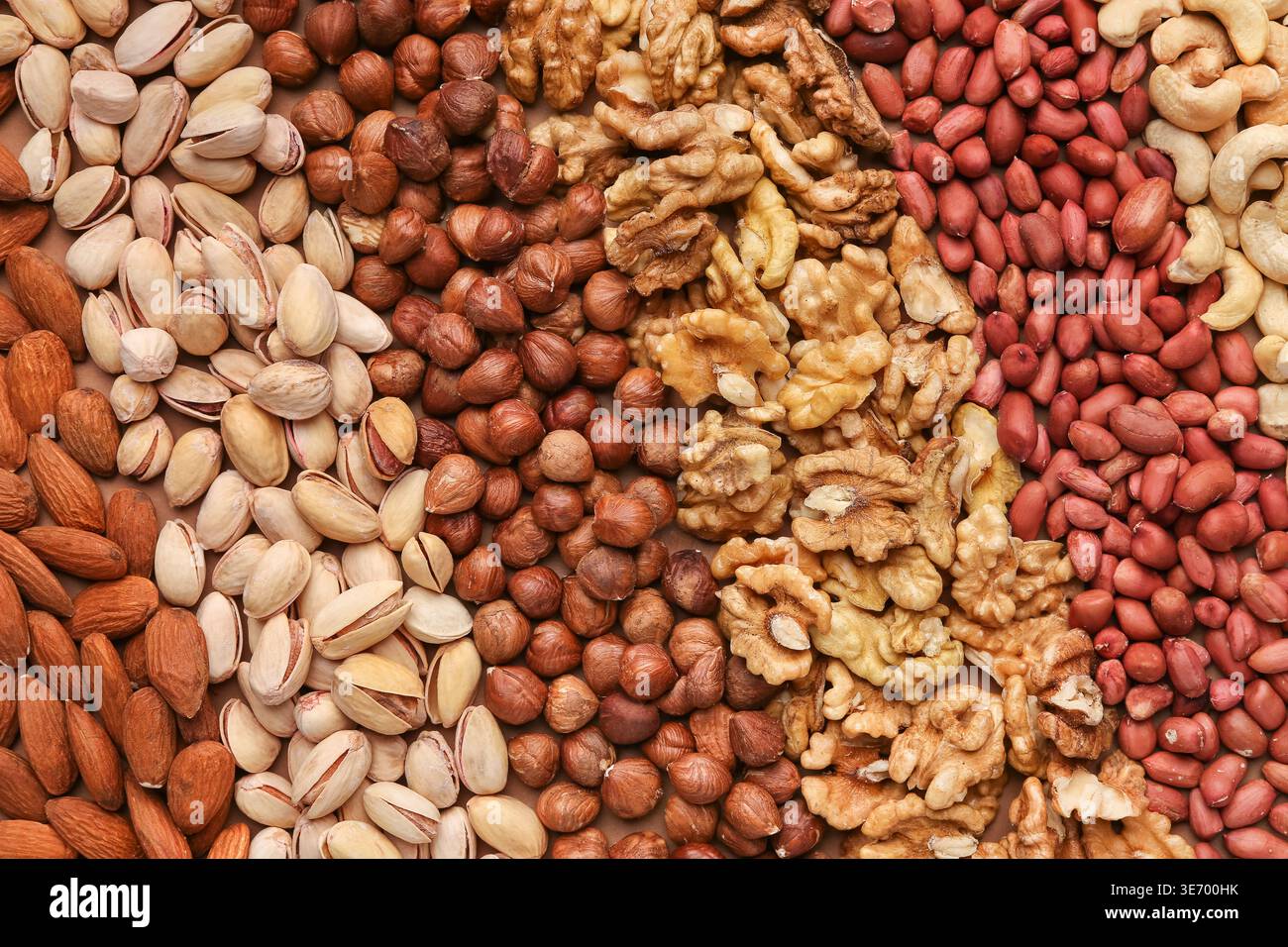 Texture of assorted nuts in rows, closeup Stock Photo