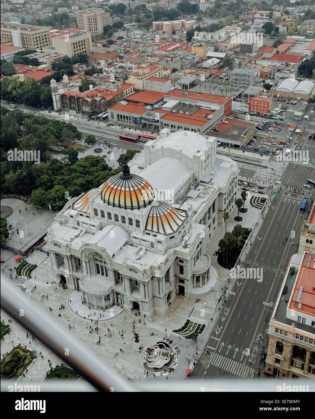 Spectacular aerial view of the Palace of Fine Arts in Mexico City. Its iconic dome, the Alameda Central park, and the vibrant urban life of one of the - Smartphone Captured Stock Image