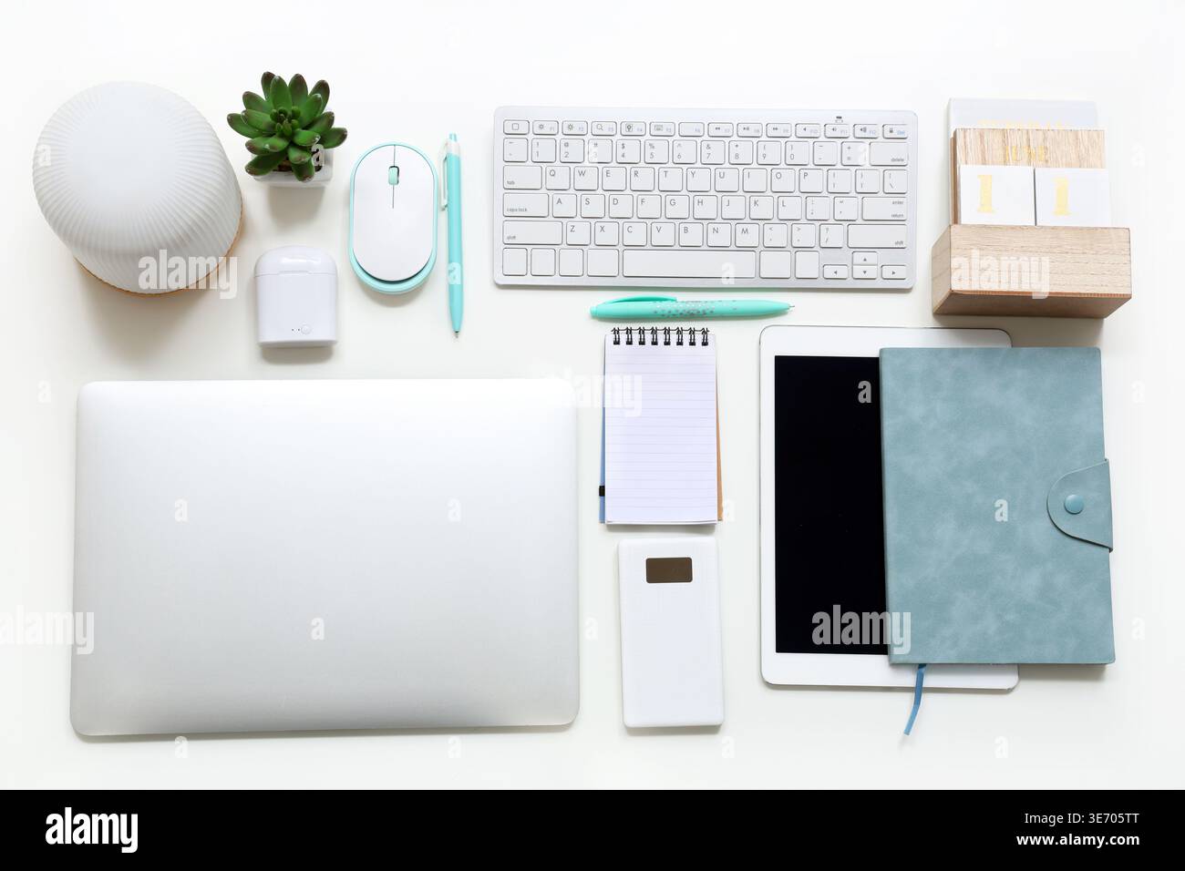 Different gadgets with notebooks on white background Stock Photo