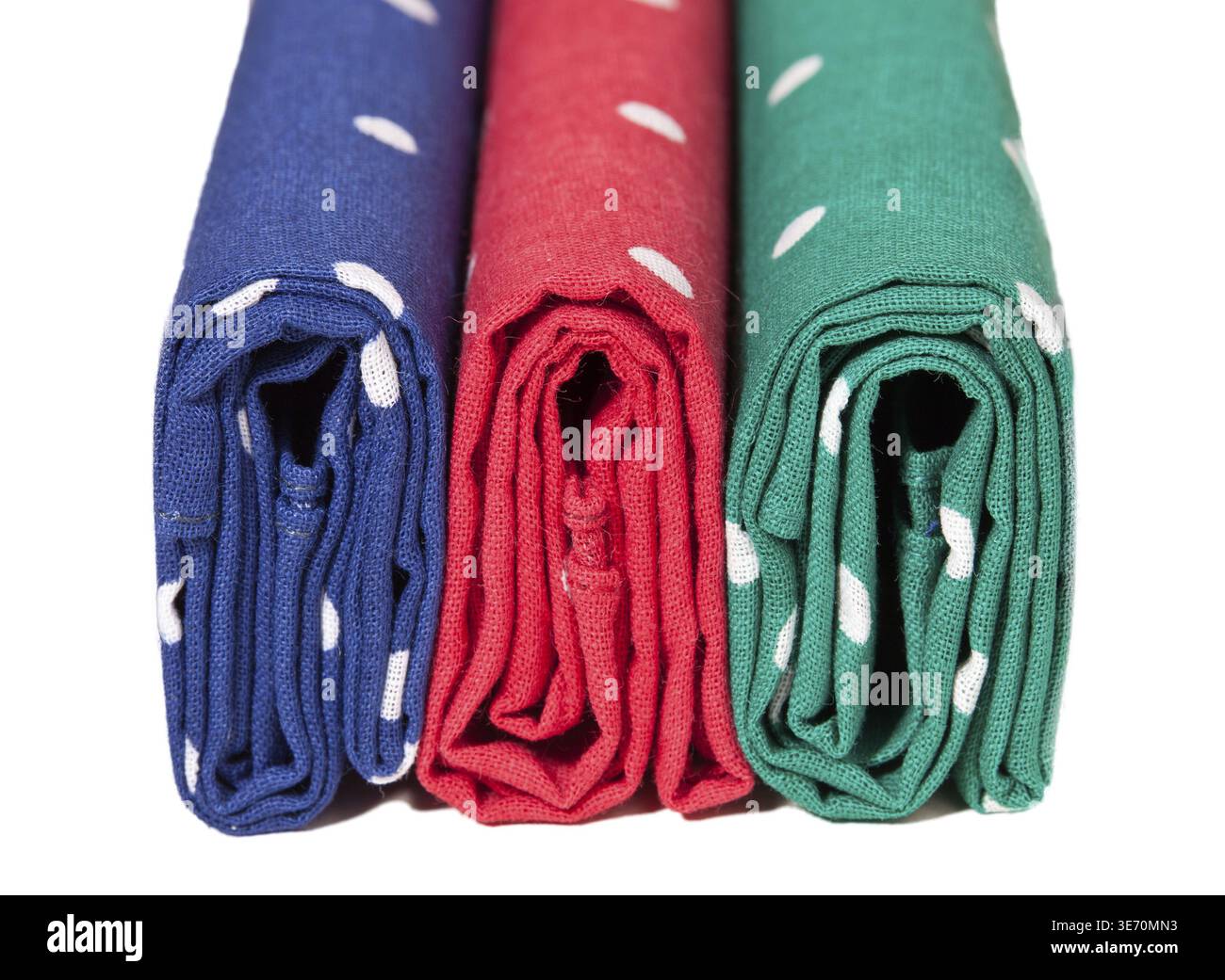 Folder linen handkerchiefs in red blue and green with white spots Stock Photo