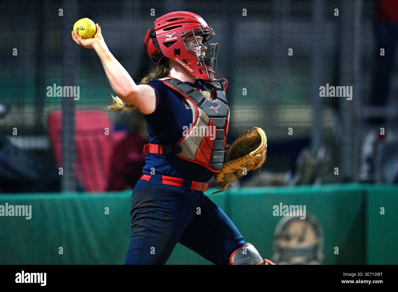 Radford catcher Amber Wolfe throws during an NCAA college softball game ...