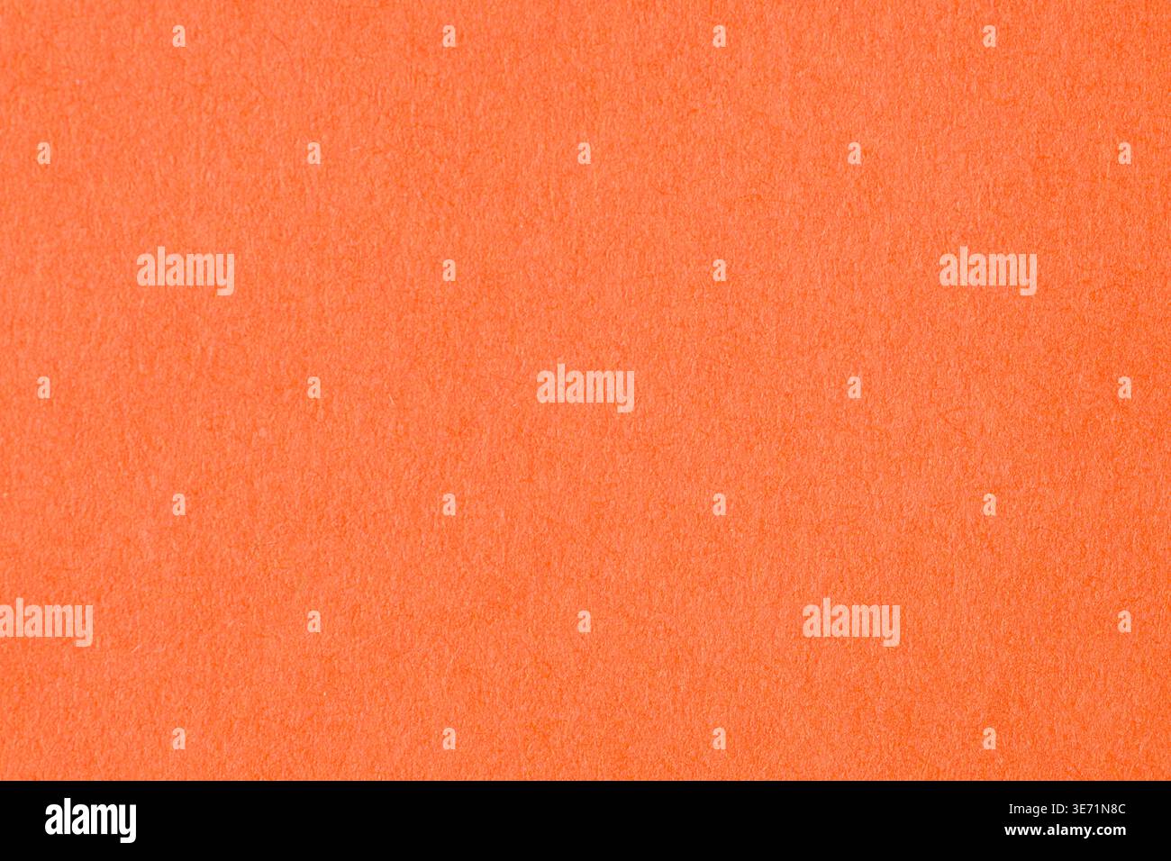 Vibrant orange textured paper background with soft grain pattern Stock Photo
