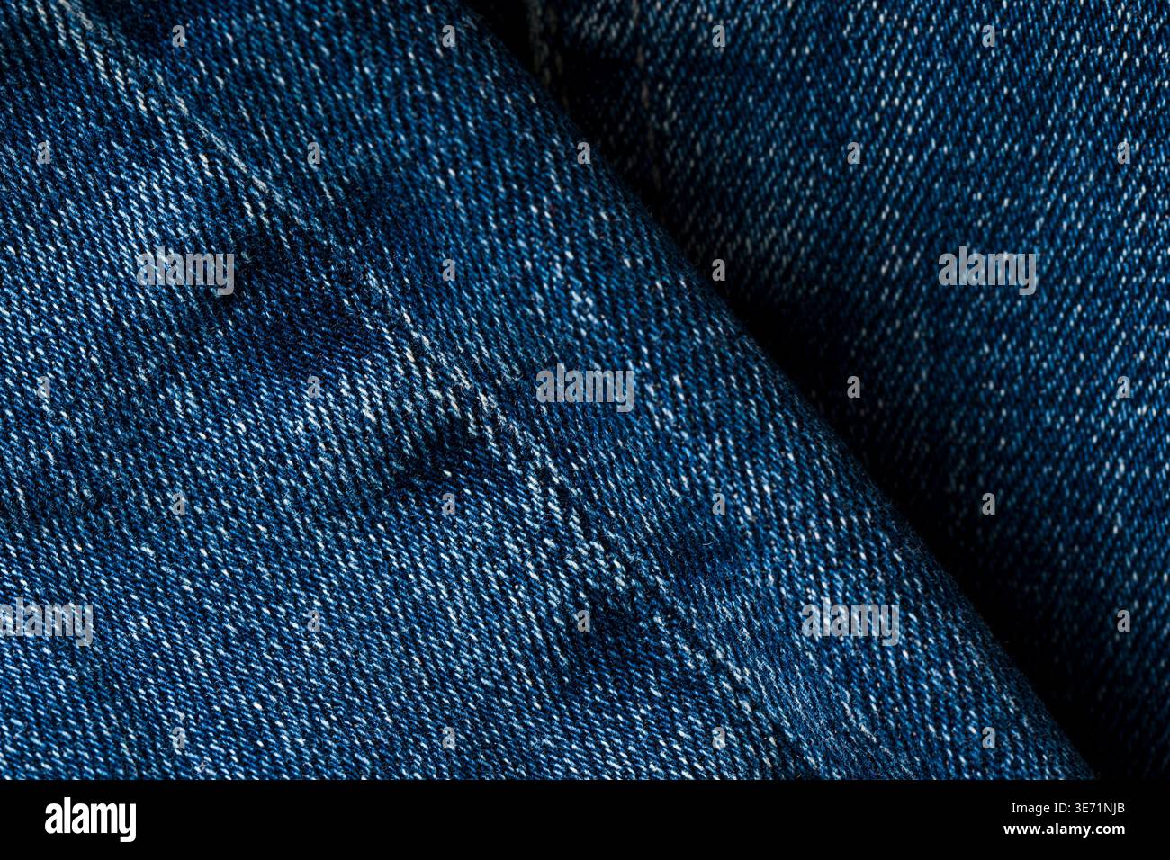Detailed blue denim fabric texture background with visible stitching pattern Stock Photo