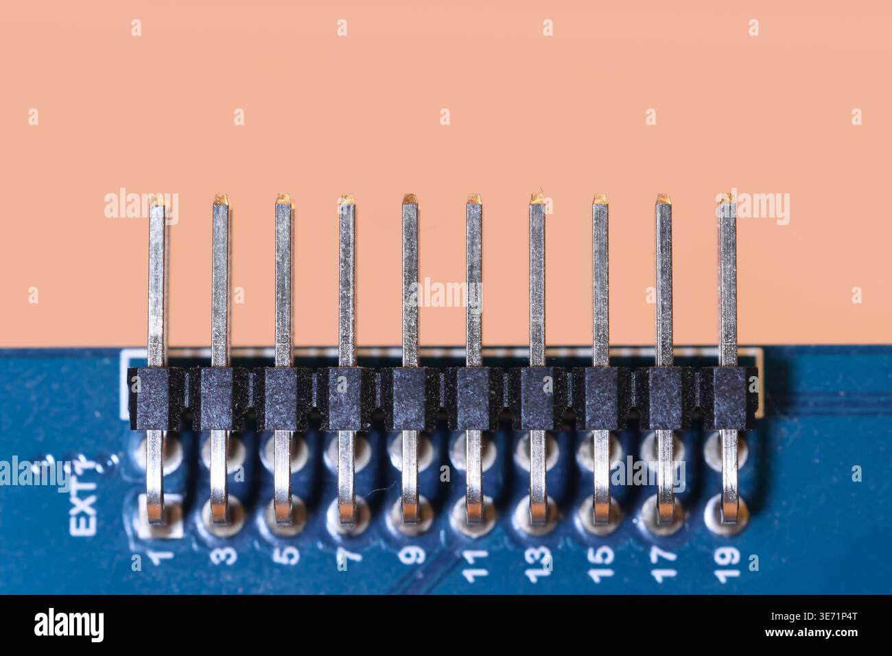 Pin header connector providing an electrical connection on a circuit board Stock Photo