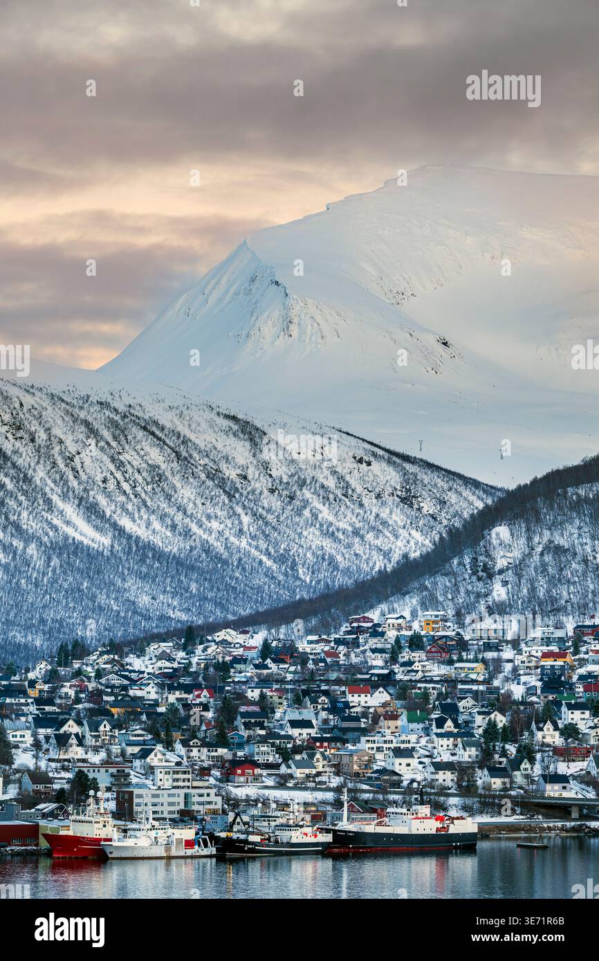 City skyline with Tromsdalstinden mountain in the background, Tromso, Troms, Norway Stock Photo