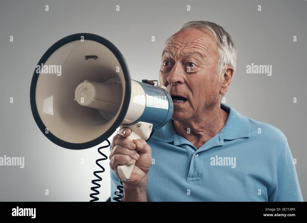 Shouting, danger or old man in studio with megaphone, alert or announcement for attention. Warning, voice or senior person on white background with Stock Photo