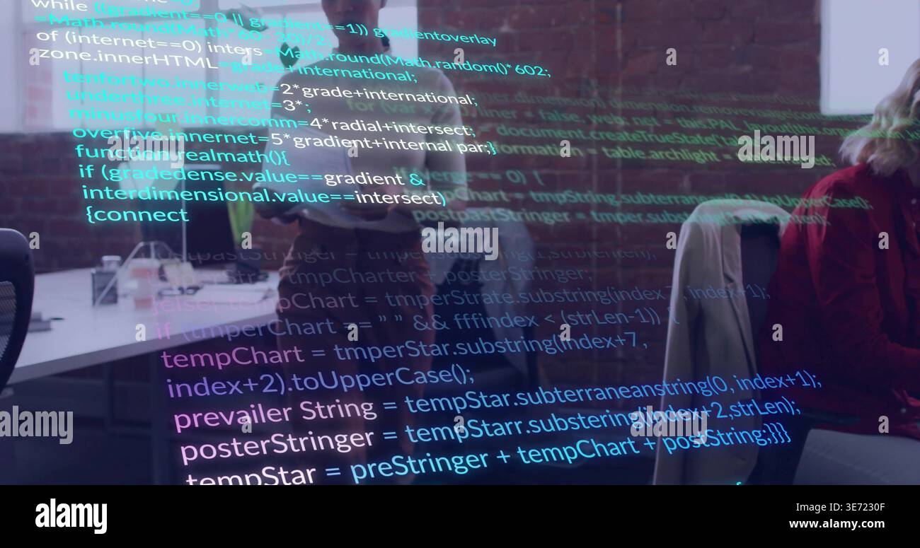 Projecting colorful source code overlay across open-plan office, with monitors, laptops, red jacket. Collaboration, coworking, developers, software, w Stock Photo