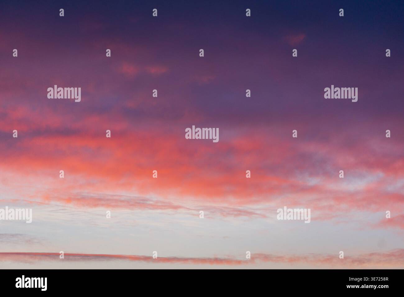 Colorful sunset sky with soft gradient clouds Stock Photo