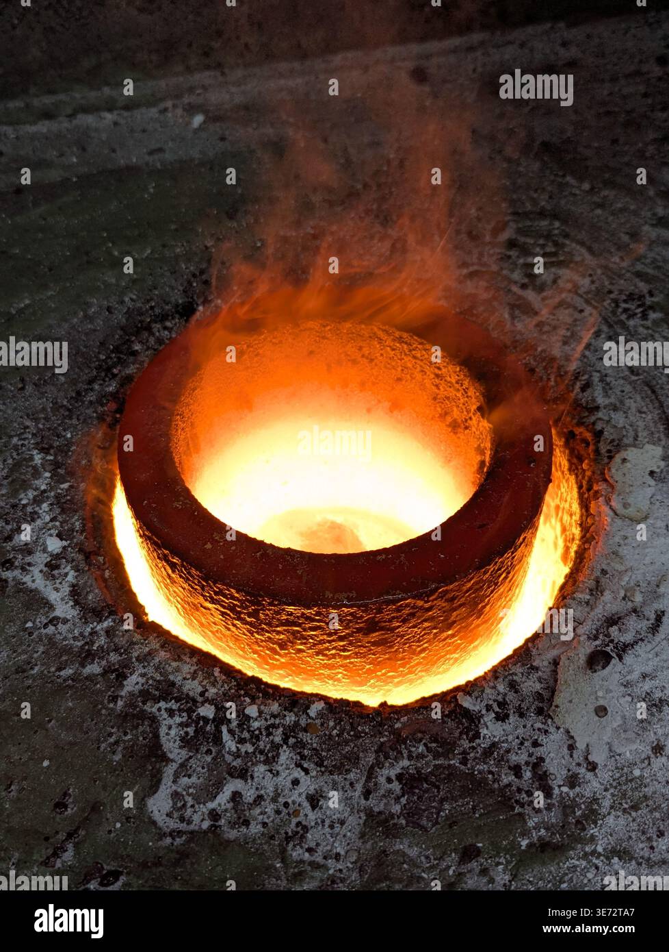 Glowing Molten Metal In Crucible, Intense Orange Core Radiating Heat ...