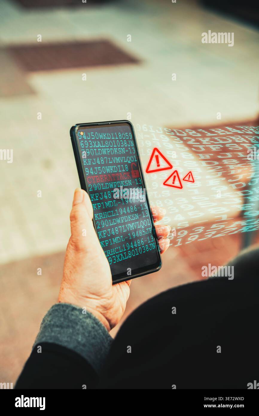 Cyberattack warning on smartphone with data breach alert and binary code overlay. Mobile security threats and data breaches. Stock Photo