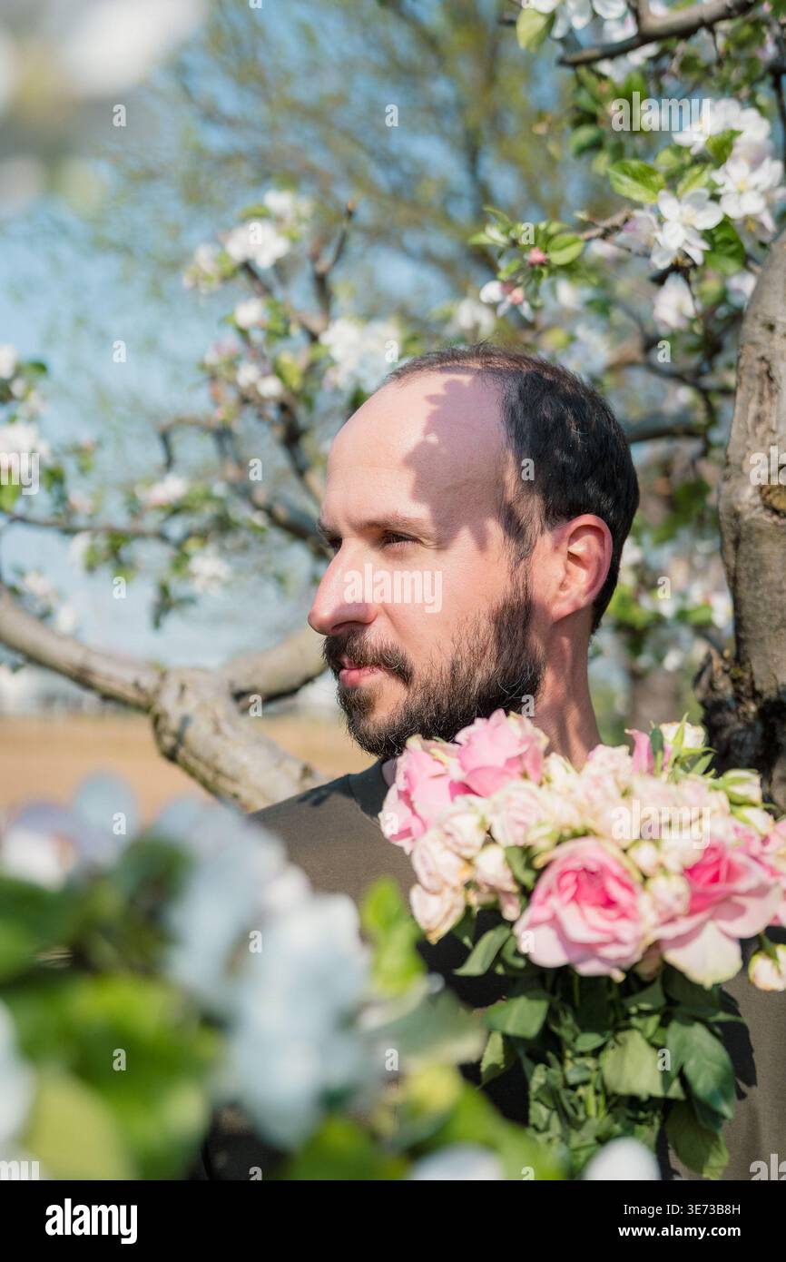 Man Among Roses Young man among roses hi-res stock photography and images - Alamy