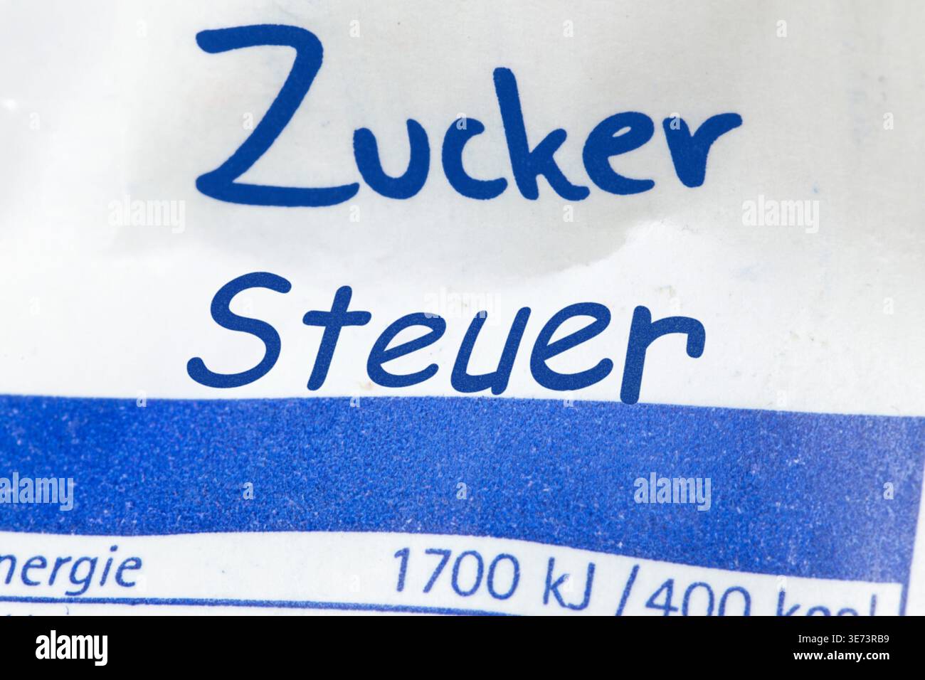 (Photo montage) The word ZUCKER (sugar) with the word STEUER (tax) added to a sugar packet Stock Photo