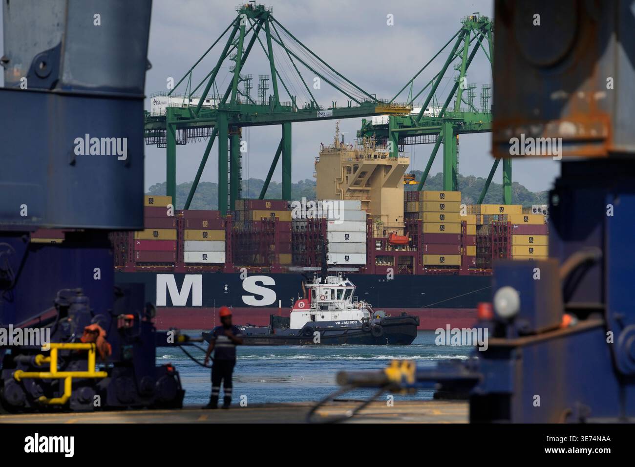 Cranes load and unload containers from cargo ships at the Panama Canal ...