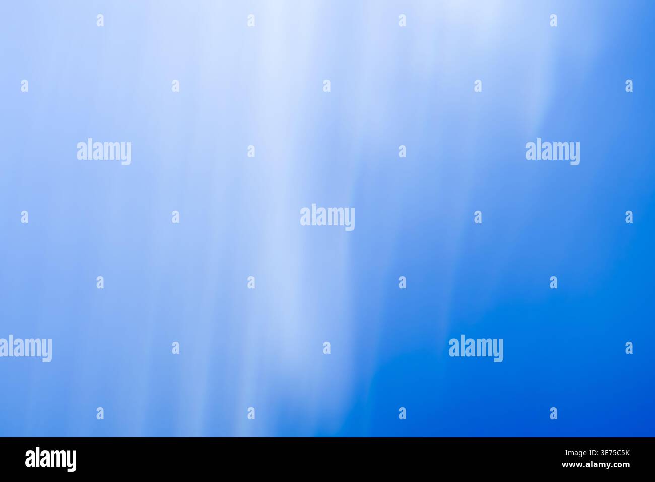 Soft ethereal blue and white abstract gradient background with subtle light rays Stock Photo