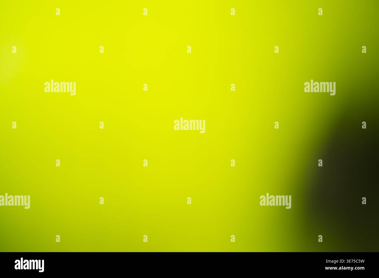 Solid vibrant lime green abstract blurred background for copy space Stock Photo